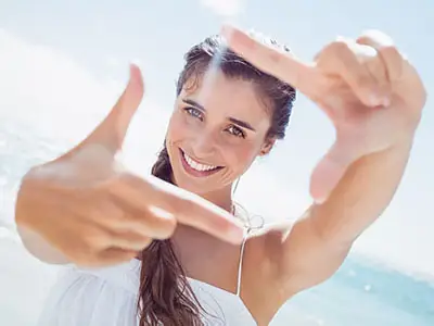 Portrait of smiling woman on the beach